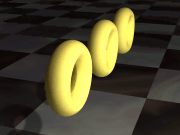 Three golden arcade-style rings spinning above a checkerboard floor