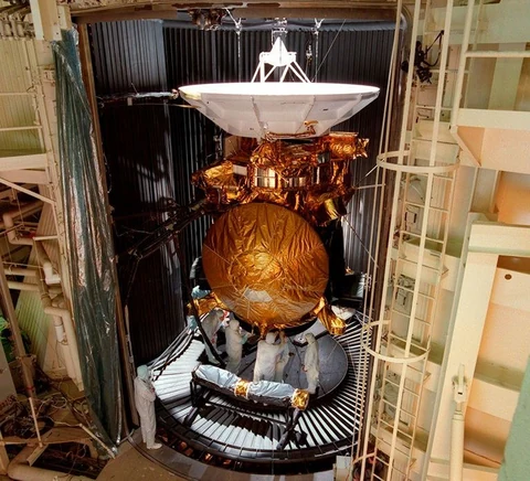 Cassini-Huygens spacecraft with its white antenna and gold insulation during ground testing in 1996